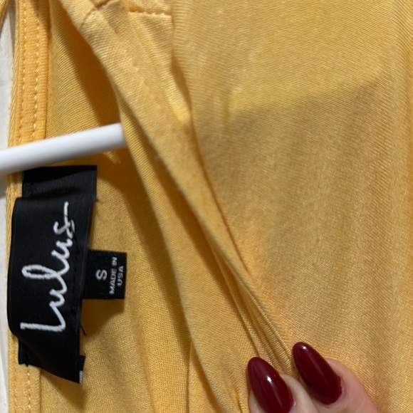 Yellow t shirt, with cute design in the back. Size small - Picture 2 of 3